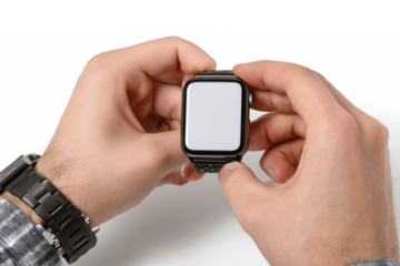 Close-up of hands holding a black smartwatch with a blank white screen, ready for customization or setup on a clean background.