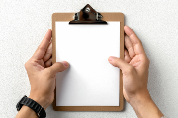 Two hands holding a blank clipboard with white paper against a plain white background, ready for text or design.