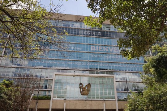 September 20, 2025, The IMSS headquarters building on Paseo de la Reforma framed by tree foliage