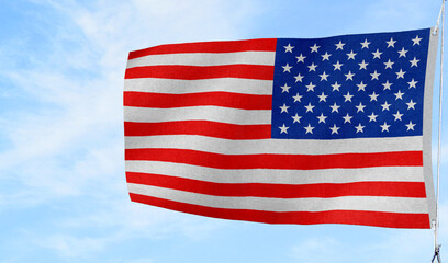 Obraz premium High-quality united states national flag flag waving against a clear blue sky - Symbol of culture, heritage, and patriotism