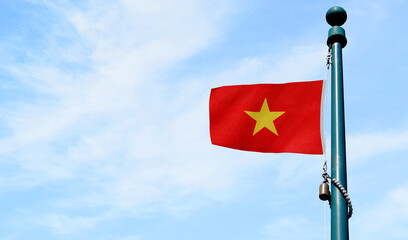 High-quality vietnam national flag flag waving on a pole against a blue - Symbol of culture, heritage, and patriotism
