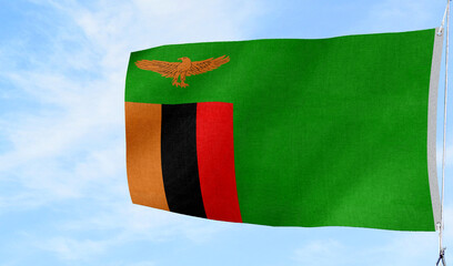 Fototapeta premium Respectful folded Zambia national flag placed on a surface — suitable for memorial and ceremonial themes.