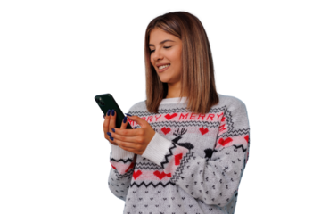 Young woman wearing christmas sweater using smartphone, enjoying holidays and connecting online