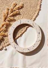 A tactile psychotherapy concept. Decorative terrazzo tiles on textured beige fabric with dried grass.