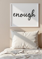 Wall art with the word 'enough' in a modern bedroom setting  