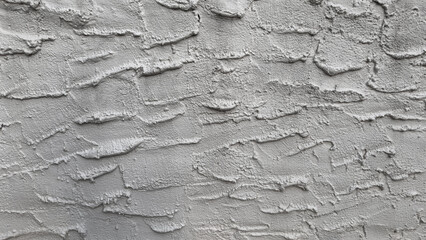 Decorative plaster effect on wall. Horizontal background.