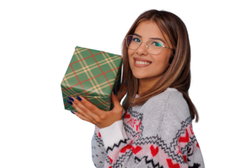 Happy woman in glasses holding a plaid christmas gift, smiling, celebrating seasonal holidays, transparent background