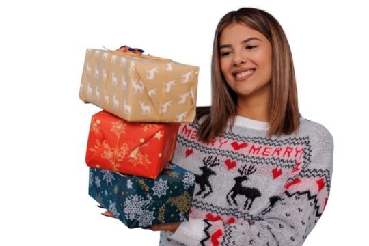 Happy woman holding christmas presents, celebrating winter holidays with festive gifts and a joyful smile - Powered by Adobe