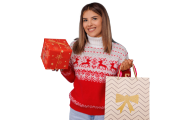Happy woman holding christmas gift and shopping bag, enjoying holiday season and festive shopping