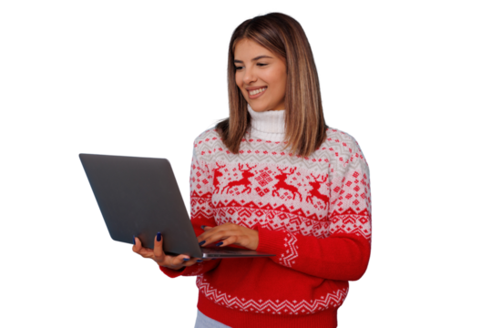 Young woman shopping online for christmas holidays, browsing internet on laptop, wearing festive winter sweater