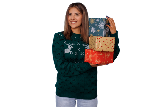 Smiling woman holding stack of christmas presents, wearing reindeer holiday sweater, transparent background