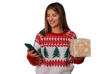 Woman wearing christmas sweater, holding smartphone and gift, holiday shopping on transparent background