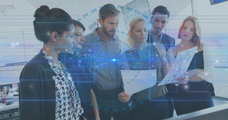 Brunette unfolding charts and handing sheet to teammate, driving data overlays in business review - Powered by Adobe