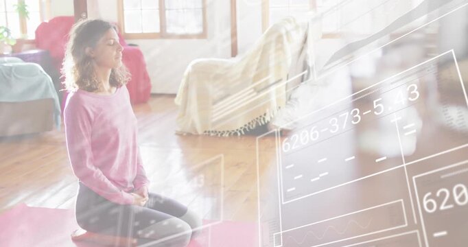 Woman kneeling on cushion starting session initiating overlay for meditation data in wellness