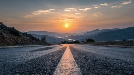 Fototapeta premium Sunrise Over Mountain Road With City View