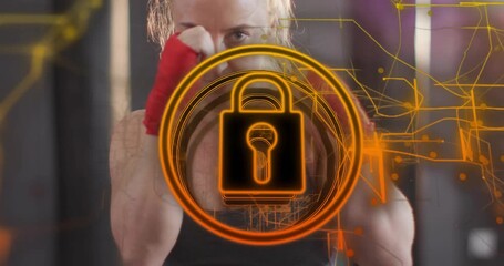 Mid adult woman adjusting red hand wraps activating fitness HUD lock icon while throwing jabs - Powered by Adobe