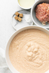 Overhead view of mise en place of ingredients for making moi moi