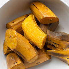 overhead view of Boiled ripe plantain in a white bowl, top view of nigerian cooked ripe plantain © this_baker