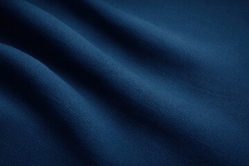 Deep blue linen fabric with gentle folds and soft shadows clean textile background