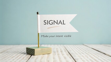 Small white flag signaling the word signal on wooden base