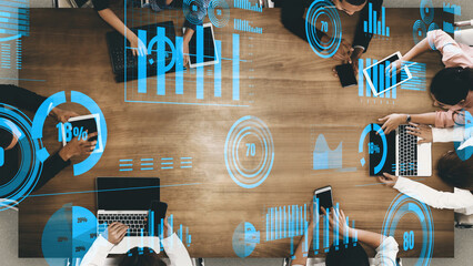 A vibrant scene of a collaborative meeting featuring diverse professionals engaged in strategic discussion. Digital analytics and graphs enhance the workspace atmosphere. Xenic