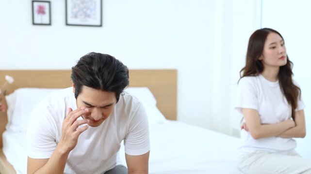 Couple facing problem, emotional sadness during relationship crisis, misunderstanding unresolved, married Asian partners in bedroom silence, emotional quiet tension, intimacy broken, hurt expression