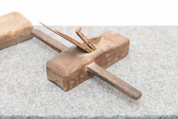 a vintage wooden hand plane used for shaping wood