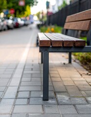 Urban park bench on a city sidewalk