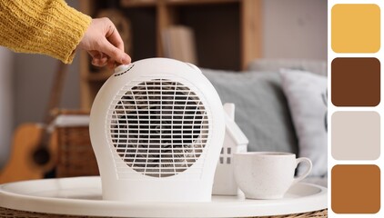 Woman using modern electric fan heater at home, closeup. Different color patterns