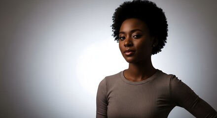 Confident Young Black Woman Holding Whisk in Kitchen