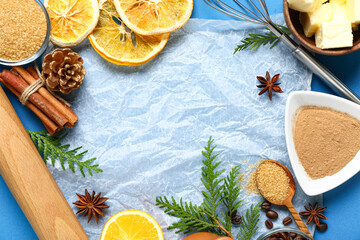 Different ingredients for preparing Christmas pie on blue background