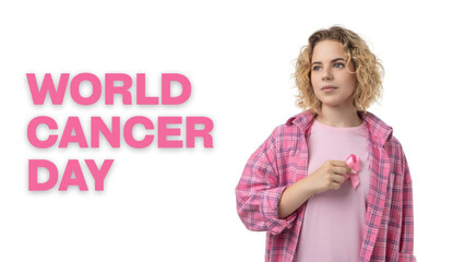 A person raises awareness for cancer by holding a pink ribbon