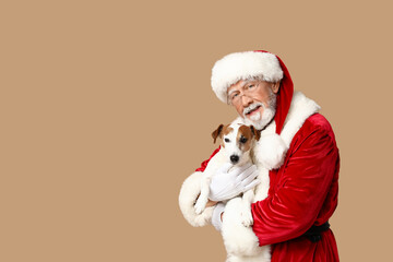 Santa Claus with cute Jack Russell Terrier dog on brown background
