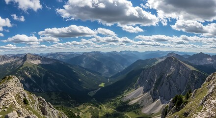 Obraz premium Majestic mountain range under a vibrant blue sky with puffy white clouds