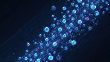 Abstract, swirling,  light blue spheres on dark background