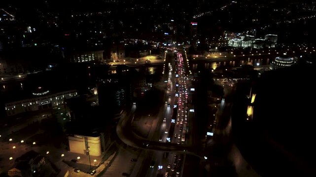 Night Traffic Jam in Skopje: Aerial View of Cars on Bridge Over Vardar River by Kale Fortress