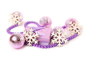 Gift box with beads, decorative snowflakes and Christmas balls on white background