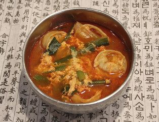 Spicy Korean Dumpling Soup with Egg and Vegetables