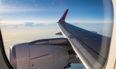 view from airplane window with airplane wing