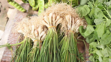 vegetable chives in stalls of Indonesian traditional market sellers
