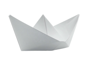 A single, crisp, white paper boat against a stark, black, isolated background