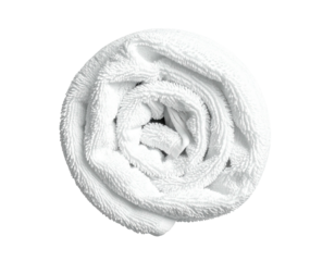 A rolled, fluffy white towel, centrally framed against a stark black background