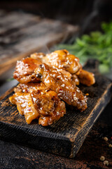Hot glazed chicken wings with sesame seeds