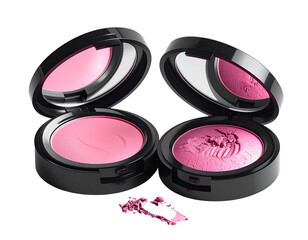 Two opened compacts with pink blush and a scattering on a dark background