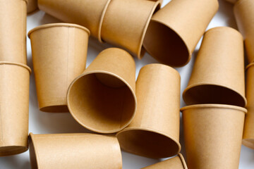 Brown paper cups on white background.