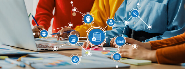 A vibrant team collaborates in a modern office environment, utilizing technology and data analysis to enhance productivity and drive innovation in their projects. Amity