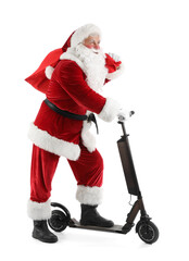 Santa Claus with bag and kick scooter isolated on white background