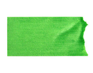 A bright green piece of textured tape with a torn edge on a black background