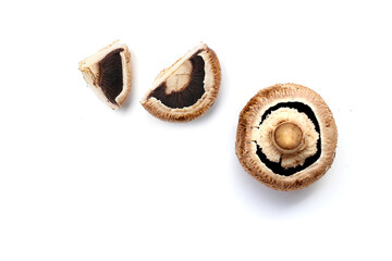 Fresh portobello mushrooms with visible gills underneath.