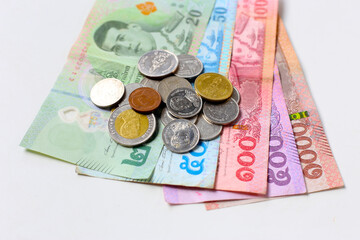 Banknotes with coins of the Thai baht money